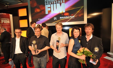 Recipients of the Director’s Promotional Award (left to right, holding awards): Christoph Hochhäusler, Ralf Westhoff, Ulrike Arnold, and Jochen Strodthoff